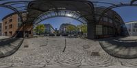 the 360 - view view of a circle of people walking on the sidewalk in a street