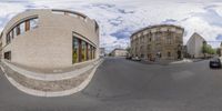 the two images are turned upside down to show different buildings in the street, and one is empty