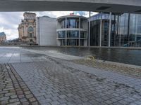 Cobblestone Streets of Berlin: A Reflection of the River and Canal