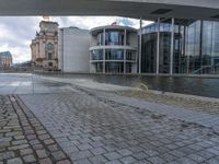 Cobblestone Streets of Berlin: A Reflection of the River and Canal