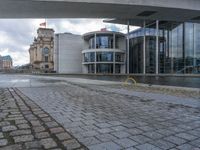 Cobblestone Streets of Berlin: A Reflection of the River and Canal