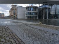 Cobblestone Streets of Berlin: A Reflection of the River and Canal