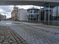 Cobblestone Streets of Berlin: A Reflection of the River and Canal