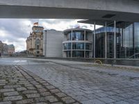 Cobblestone Streets of Berlin: A Reflection of the River and Canal