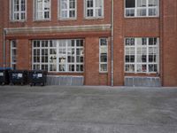 a red fire hydrant in front of a building next to an open door to a store