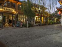 Cobblestone Streets at Dawn: Yellow Lights and Cafes