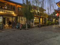 Cobblestone Streets at Dawn: Yellow Lights and Cafes