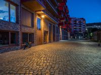 Cobblestone Streets Illuminated: City Night in Berlin