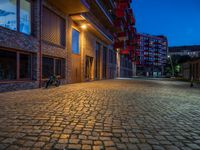 Cobblestone Streets Illuminated: City Night in Berlin