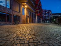 Cobblestone Streets Illuminated: City Night in Berlin