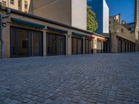 Cobblestone Surface: An Urban Courtyard Architecture