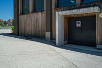 a door and door to the building on the side of the street with a fire hydrant outside