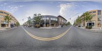 a fish eye lens that has a street in the middle of it and an intersection on each side