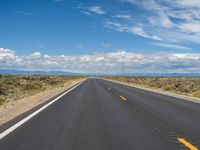 Colorado Asphalt: Clear Sky and Majestic Mountains