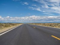 Colorado Asphalt: Clear Sky and Majestic Mountains