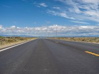 Colorado Asphalt: Clear Sky and Majestic Mountains