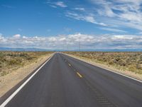 Colorado Asphalt: Clear Sky and Majestic Mountains