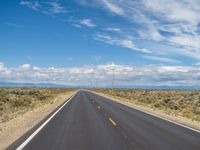 Colorado Asphalt: Clear Sky and Majestic Mountains