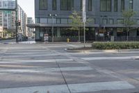 this is an empty street with a stop sign by the bus stop and two people on the street