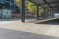 a fire hydrant in front of an office building with glass doors and windows on a sunny day