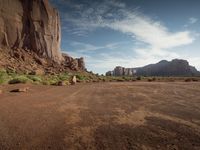 a view of some rocks and mountains on a sunny day, from the desert area