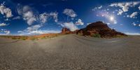 this is a view from a fisheye view point on the road in the desert