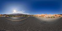 this time lapse image shows an empty road leading into the desert with red rock formations