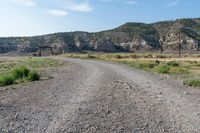 there is no image to describe in the slides below this article, a view of a dirt road