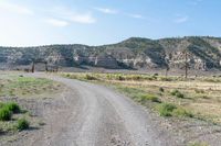 there is no image to describe in the slides below this article, a view of a dirt road