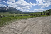 Colorado's Highlands: Exploring the Green Grass Surface and Mountain Ranges