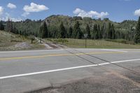 Colorado Landscape: Asphalt Road Through Mountains and Forests