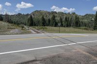 Colorado Landscape: Asphalt Road Through Mountains and Forests