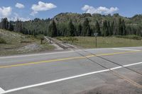 Colorado Landscape: Asphalt Road Through Mountains and Forests