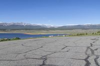 there is an empty parking lot at the bottom of the mountain range in colorado it's very empty, but still very empty