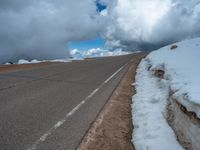 a person is on the top of a ramp on a steep hill by the ocean