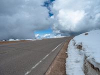 a person is on the top of a ramp on a steep hill by the ocean