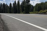 a fire hydrant sitting in the middle of the road on the side of the road