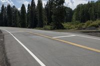 a fire hydrant sitting in the middle of the road on the side of the road