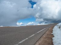 a person is on the top of a ramp on a steep hill by the ocean