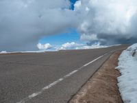 a person is on the top of a ramp on a steep hill by the ocean