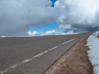 a person is on the top of a ramp on a steep hill by the ocean