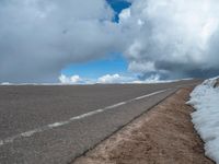 a person is on the top of a ramp on a steep hill by the ocean