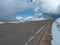 a person is on the top of a ramp on a steep hill by the ocean