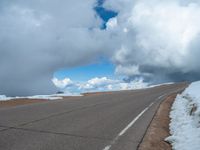 a person is on the top of a ramp on a steep hill by the ocean