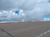 a person is on the top of a ramp on a steep hill by the ocean