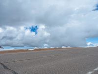 a person is on the top of a ramp on a steep hill by the ocean