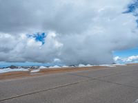 a person is on the top of a ramp on a steep hill by the ocean