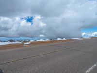 a person is on the top of a ramp on a steep hill by the ocean