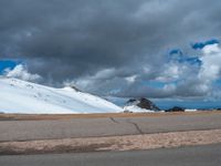 a person is on the top of a ramp on a steep hill by the ocean