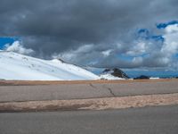 a person is on the top of a ramp on a steep hill by the ocean